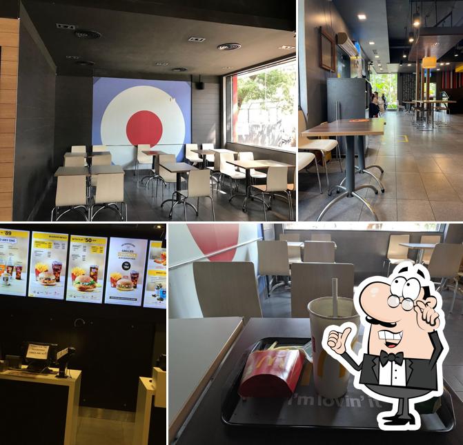 Take a seat at one of the tables at McDonald's - Nehru nagar