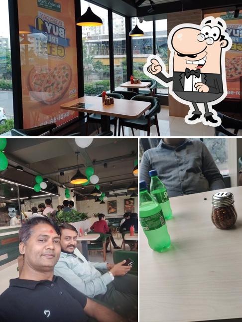 Take a seat at one of the tables at Drizzle's Pizza