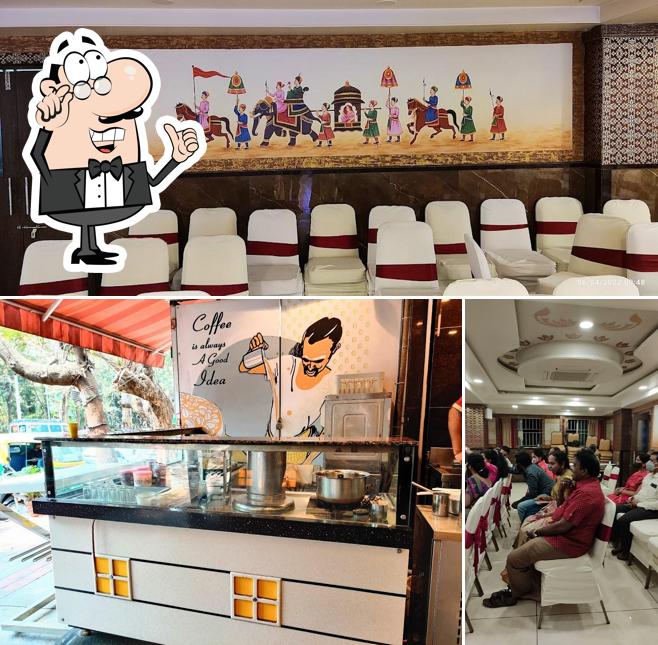 Take a seat at one of the tables at Vijayalakshmi Veg - Basavanagudi ವಿಜಯಲಕ್ಷ್ಮೀ ಸಸ್ಯಾಹಾರಿ ಹೋಟೆಲ್ - ಬಸವನಗುಡಿ