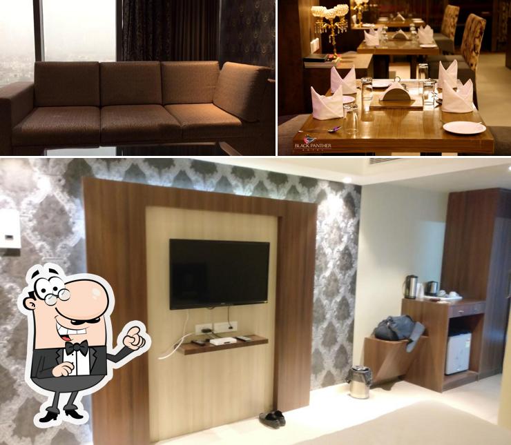 Take a seat at one of the tables at Hotel Black Panther