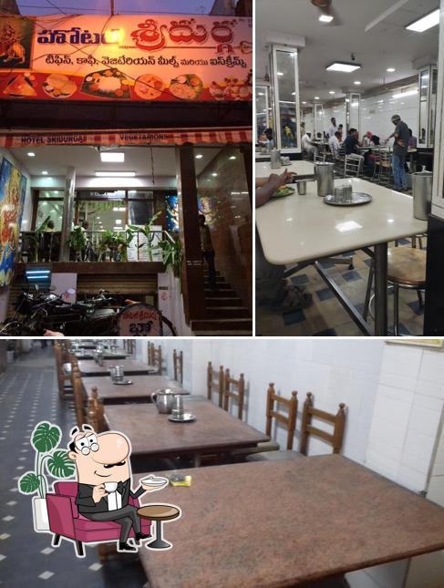 Take a seat at one of the tables at Hotel Sri Durga