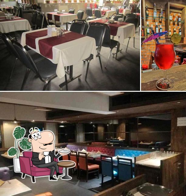 Take a look at the photo showing interior and beverage at National Punjab Casual Dining N Bar