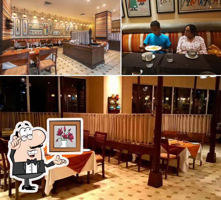 This is the photo depicting interior and dining table at The Village