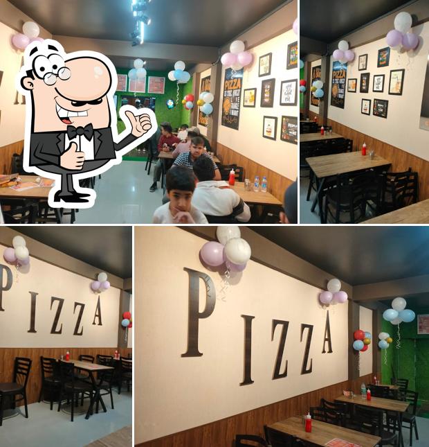 Here's a photo of Mountain'S PIZZA Club, Sanjauli