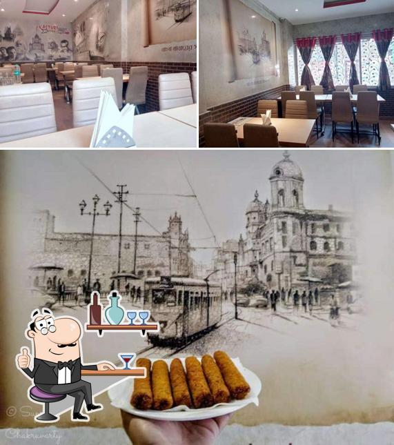 Take a seat at one of the tables at KASTURI RESTAURANT