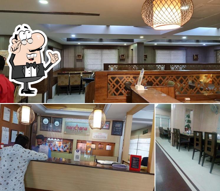 Take a seat at one of the tables at Nandhana Palace - Andhra Style - New Bel Road