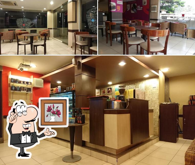 Take a seat at one of the tables at Café Coffee Day