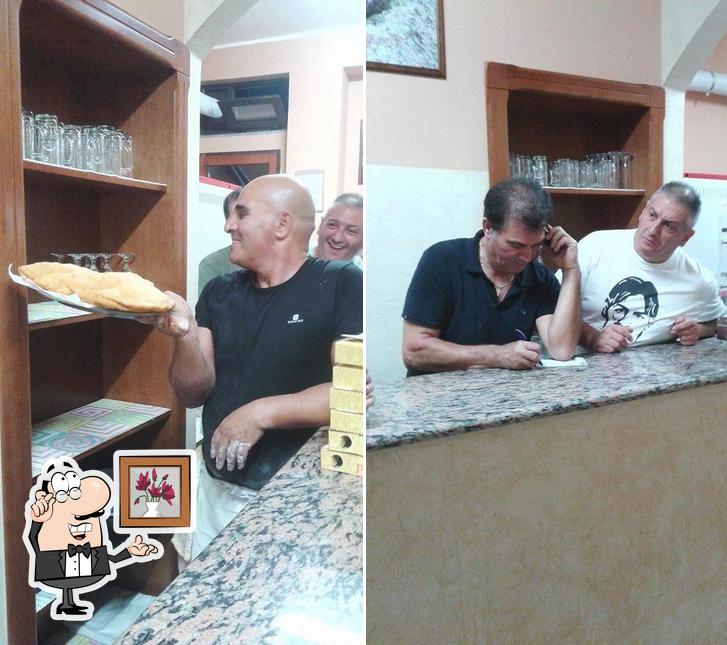 Dai un'occhiata agli interni di Pizzeria La Piazzetta