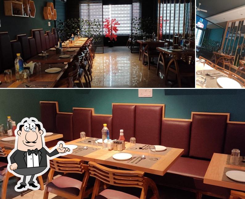 Take a seat at one of the tables at Thikana "The Food Cafe"