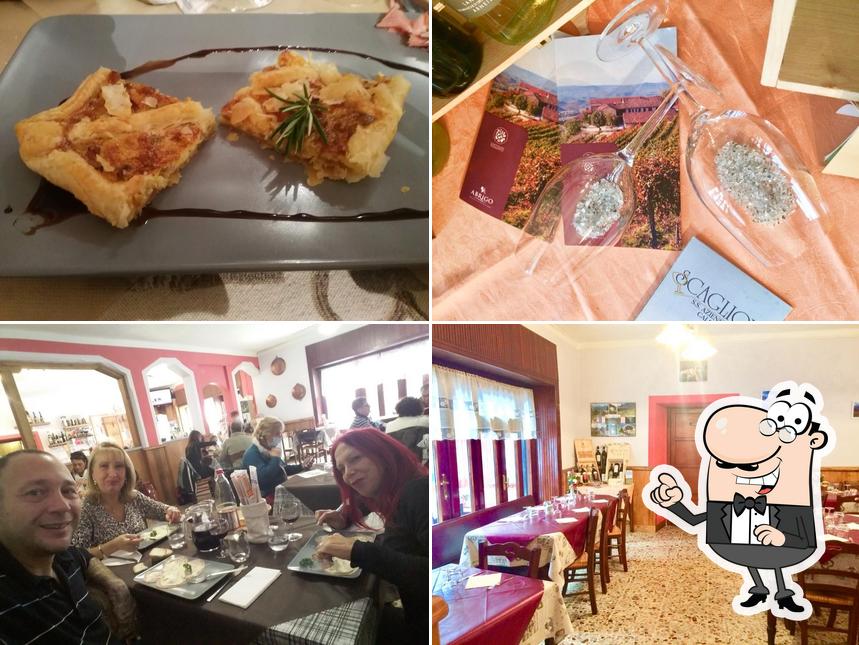 Questa è la immagine che presenta la interni e cibo di Trattoria del sole