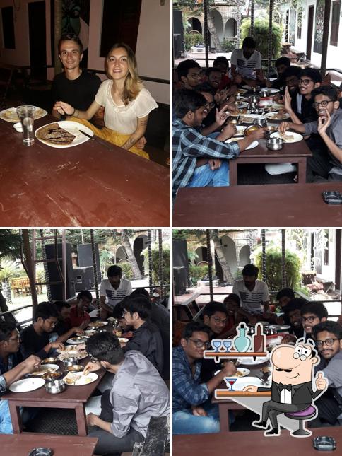 Take a seat at one of the tables at Avocado Garden Restaurant