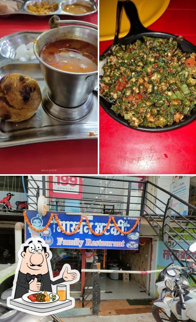 Check out the picture showing food and exterior at Makhan Matki