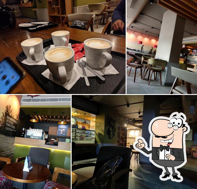 Take a seat at one of the tables at Café Coffee Day