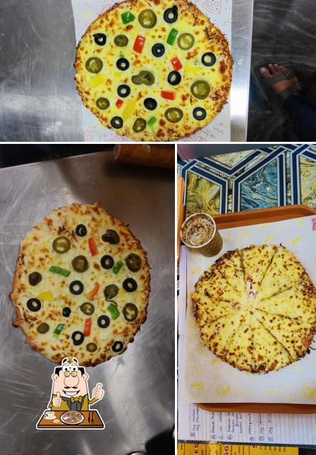Try out pizza at Heaven Café Green Empire