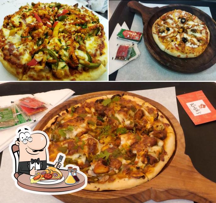 Pick pizza at Krish's Restaurant and Cafe Pure Veg