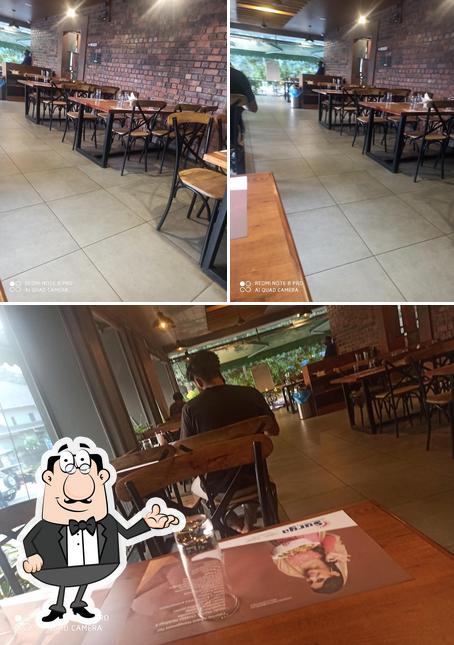Take a seat at one of the tables at SURYA Restaurant
