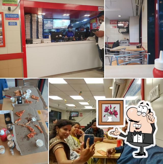 Take a seat at one of the tables at Domino's Pizza Keshav Nagra, Solapur