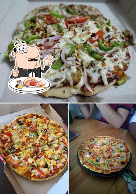 Get pizza at Jhakkas