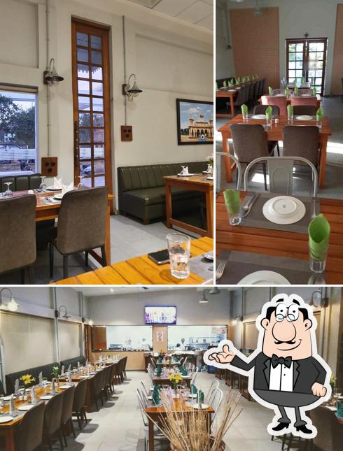 Take a seat at one of the tables at B B C Courtyard Restaurant