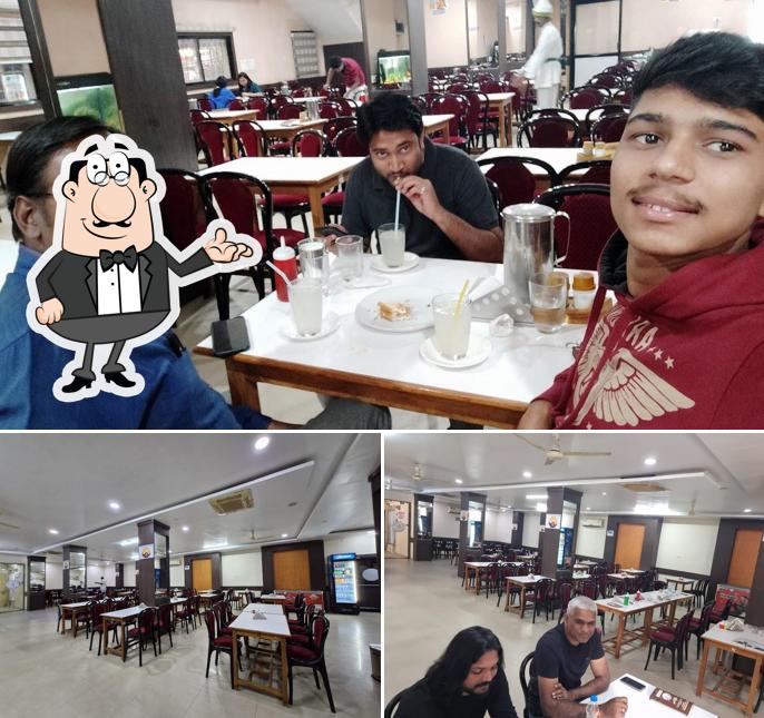Take a seat at one of the tables at Indian Coffee House