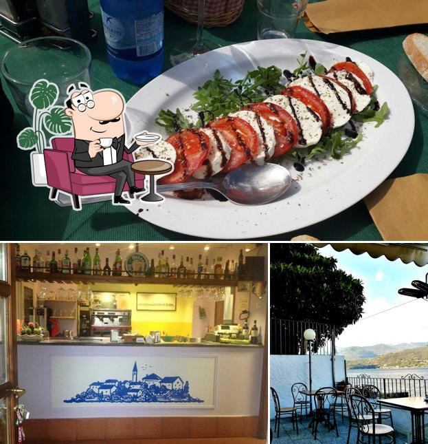 Questa è la foto che presenta la interni e cibo di New Bar