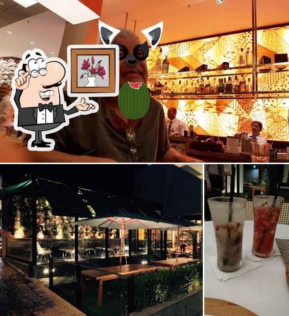 Sente em uma das mesas no Olegário Pátio