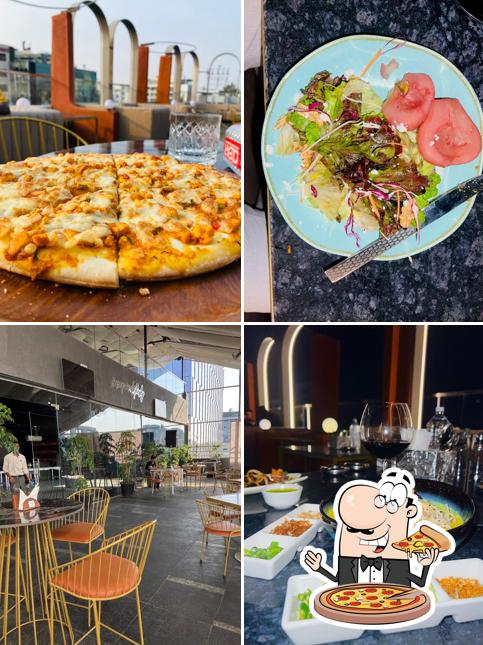 Get pizza at Escada All Day Kitchen & Bar