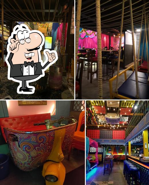 Take a seat at one of the tables at Angrezi Dhaba