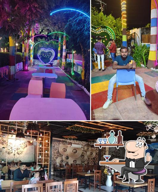 Take a seat at one of the tables at Baithak Restaurant Firozabad