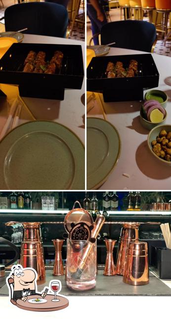Among different things one can find food and bar counter at The Escape Lounge