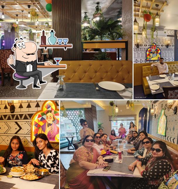 Take a seat at one of the tables at LANGAR Bistro & Restro