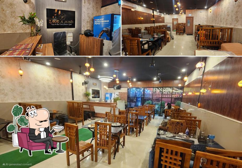 Take a seat at one of the tables at ZAHAR AL MANDI