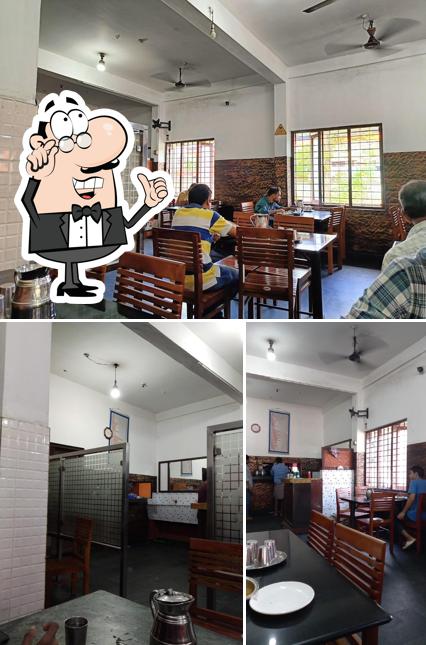 Take a seat at one of the tables at Anoop Restaurant