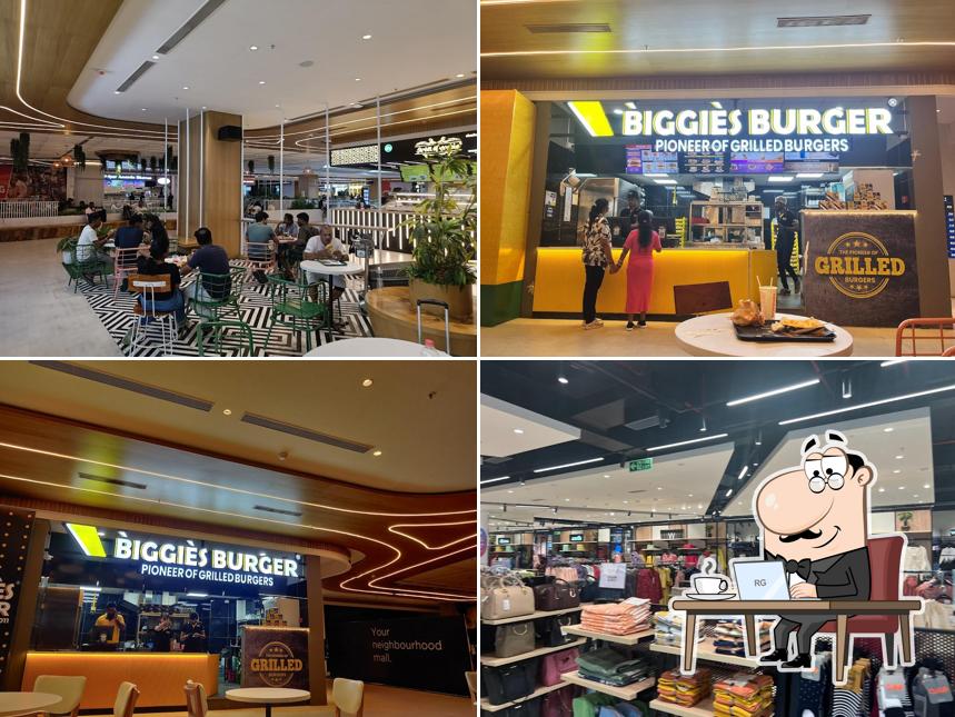 Take a seat at one of the tables at Biggies Burger: Aero Hub