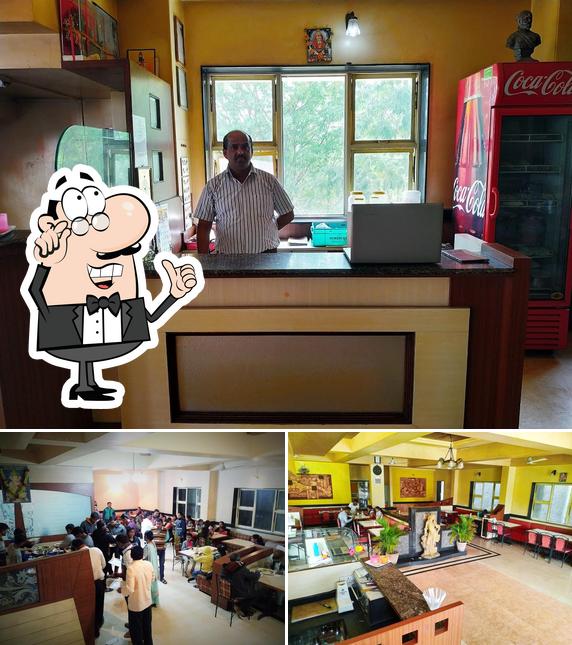 Take a seat at one of the tables at Swadesh Restaurant