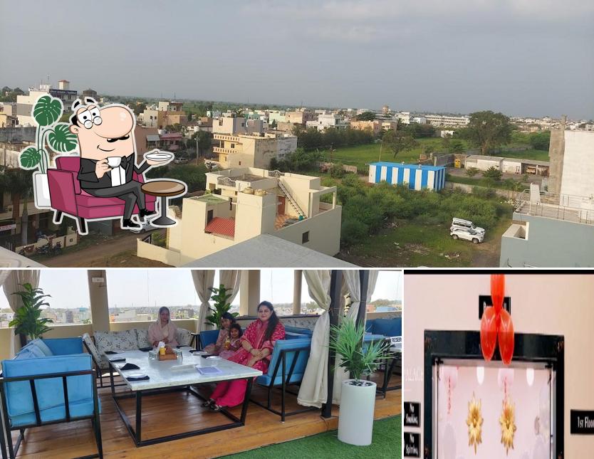 Take a seat at one of the tables at Aaura Restaurant and Grill