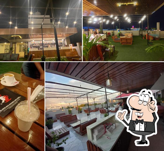 Take a seat at one of the tables at The UpperDeck Snooker Cafe & Grill - Best Cafe and Best Fast Food in Bhavnagar Best Coffe and Best Shake in Bhavangar