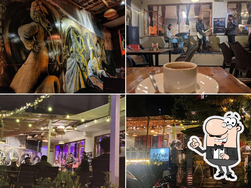 Take a seat at one of the tables at Art Café Manali