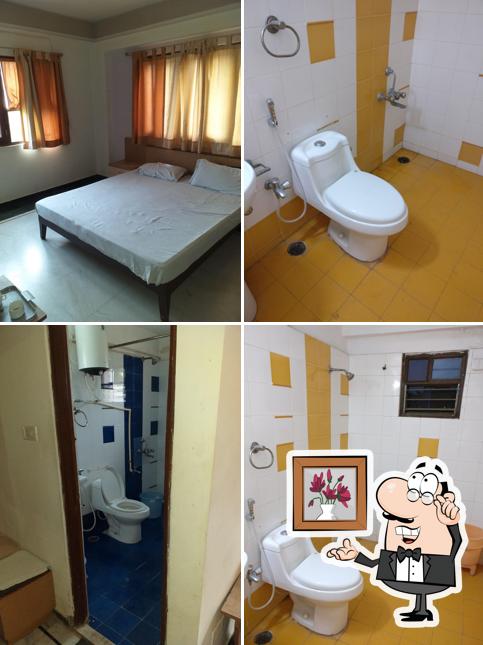 Take a seat at one of the tables at Hotel Shrinath Inn