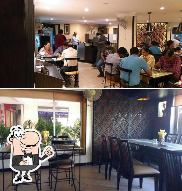 Take a seat at one of the tables at Seventh Heaven - Best Restaurant In Ranchi