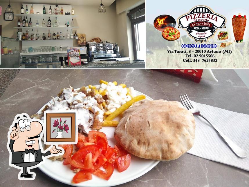 Dai un'occhiata agli interni di Pizzeria La Nuova Stella