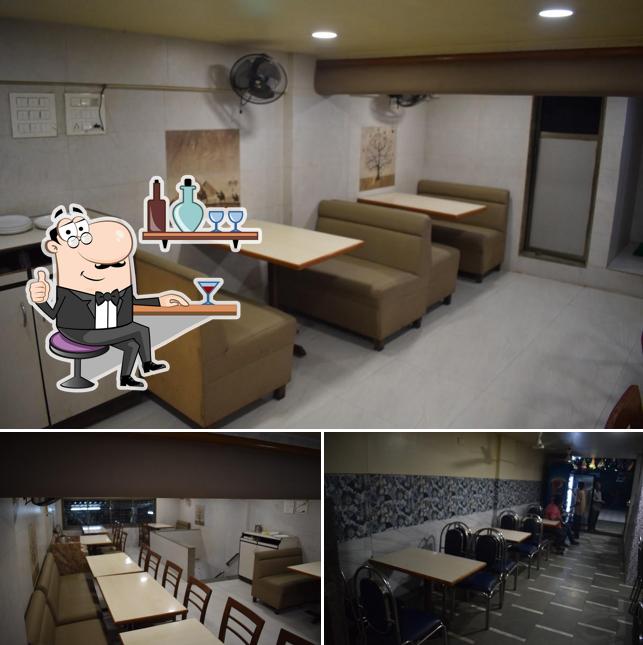 The interior of HOTEL RADHAKRISHNA NX Veg Restaurant