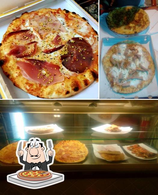 Scegli una pizza a El Castillo