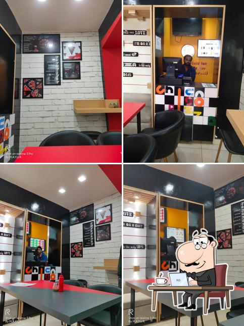 Take a seat at one of the tables at Chicago Pizza Hardoi Best Pizza in Hardoi