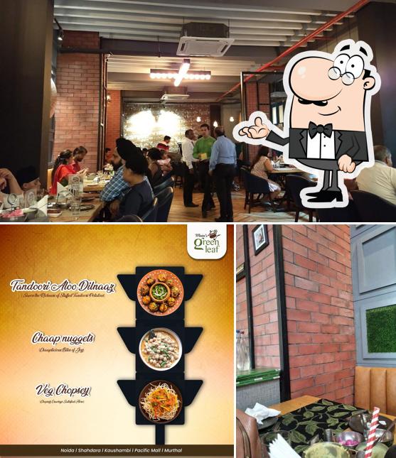 Take a seat at one of the tables at Maini's Green Leaf