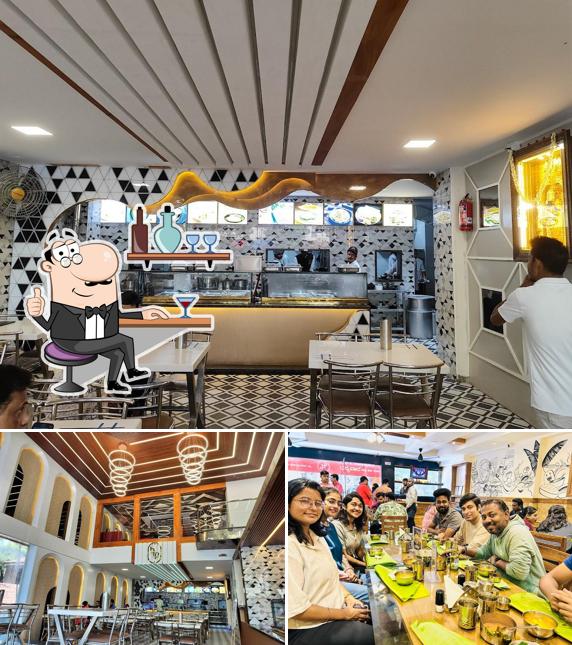 Take a seat at one of the tables at Bangalore Food Paradise