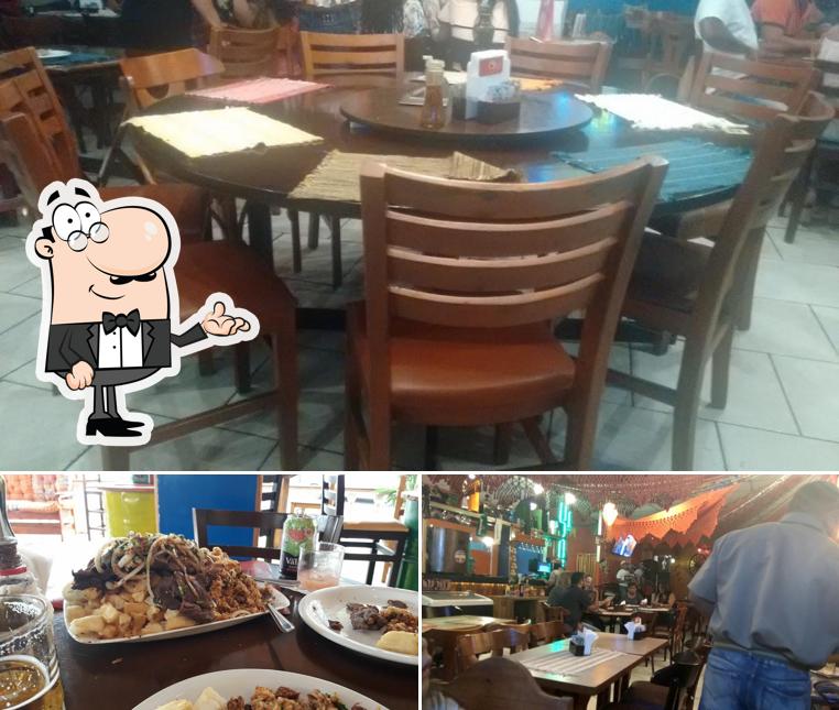 Sente em uma das mesas no Gigante Nordestino Bar e Restaurante