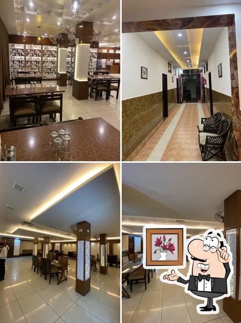 Take a seat at one of the tables at Lakhanpal Hotel & Restaurant