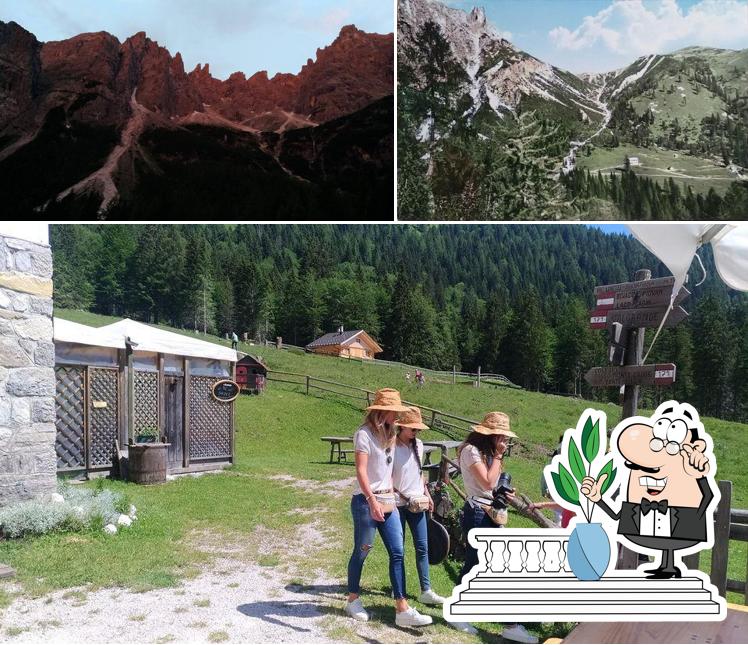 Puoi goderti l'aria fresca da seduto all'esterno di Rifugio Italo Lunelli