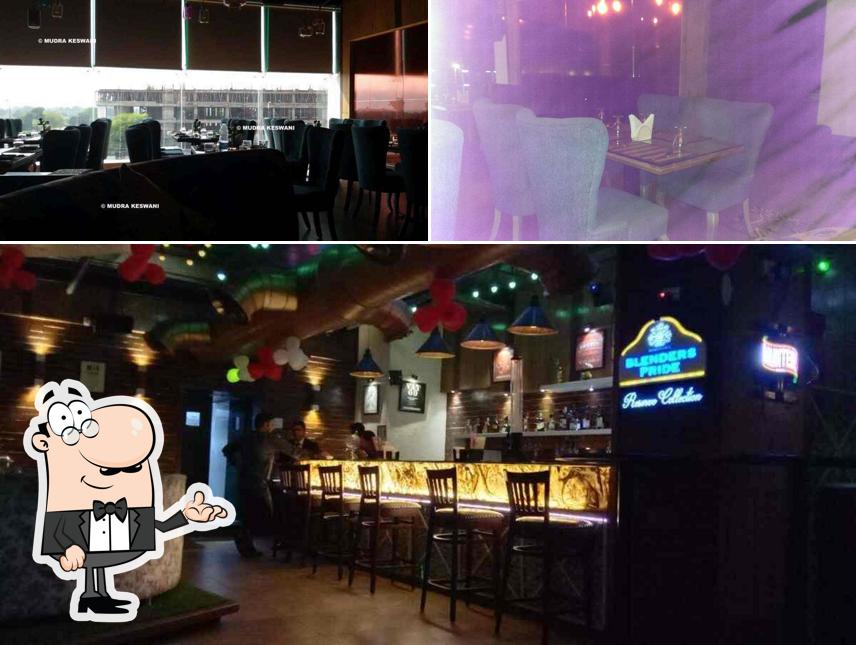 Take a seat at one of the tables at Sheesha Sky Lounge